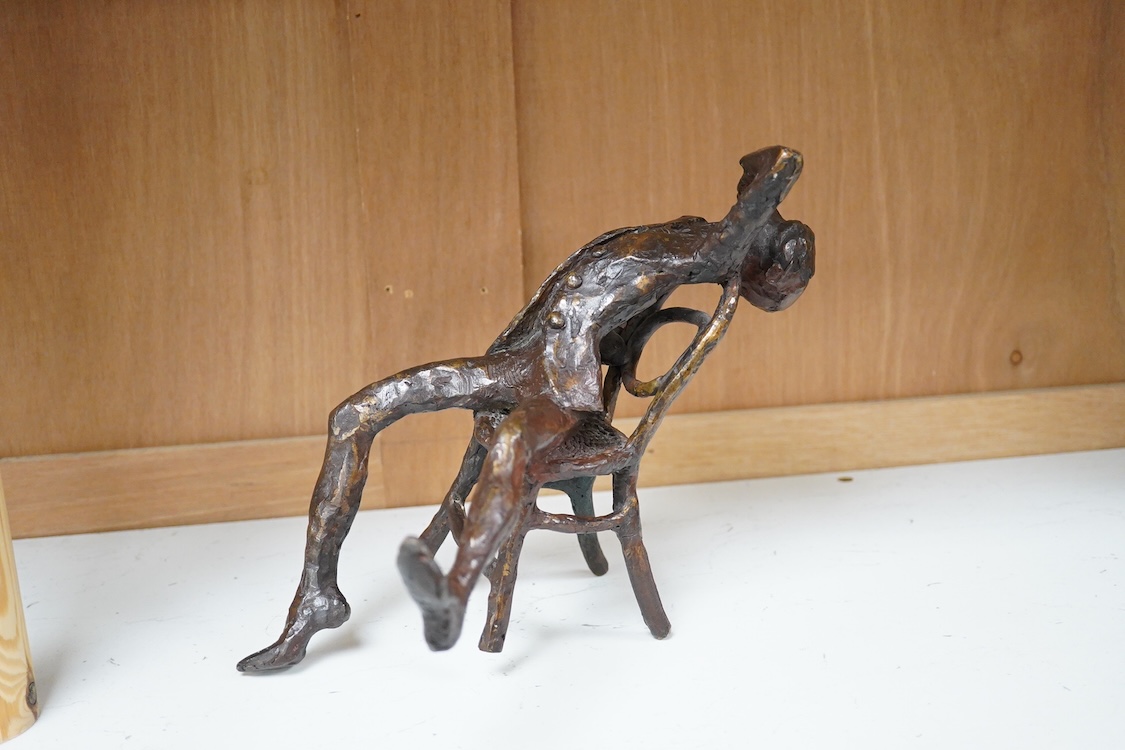 Attributed to Gerda Rubenstein (1931-2022), bronze figure of a seated man stretching, 20cm high
